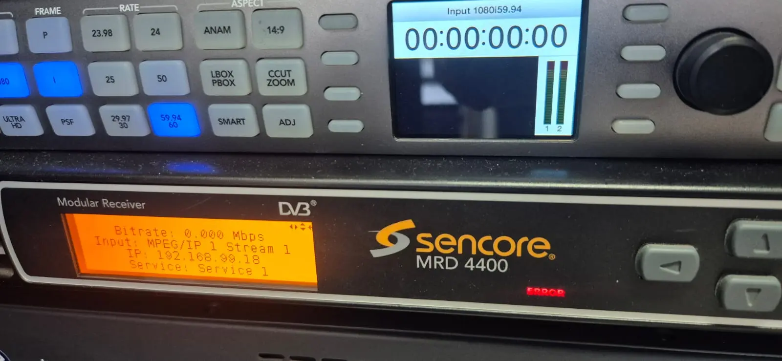 The Sencore IRD/MRD decoding a MoQ-sourced feed on the EDIS bench, driven to SDI.